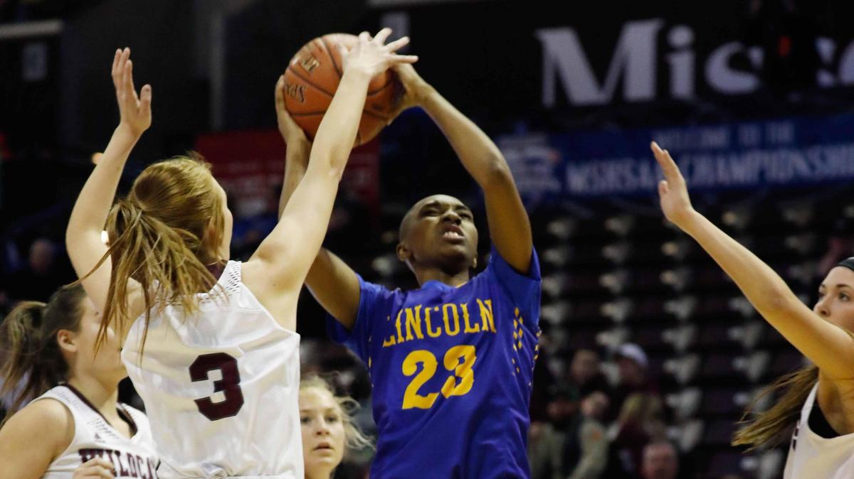 Lincoln College Prep defeated Logan-Rogersville in the first round of the State Basketball Class 4 Girls Championship.Brionna Bugetts, 23, goes up for a shot.