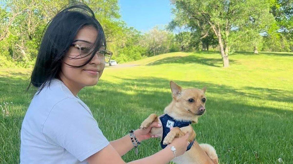 Britney Castro-Lopez of Kansas City, Kansas, with her dog, Uzamaki. Britney was shot and killed at age 19.