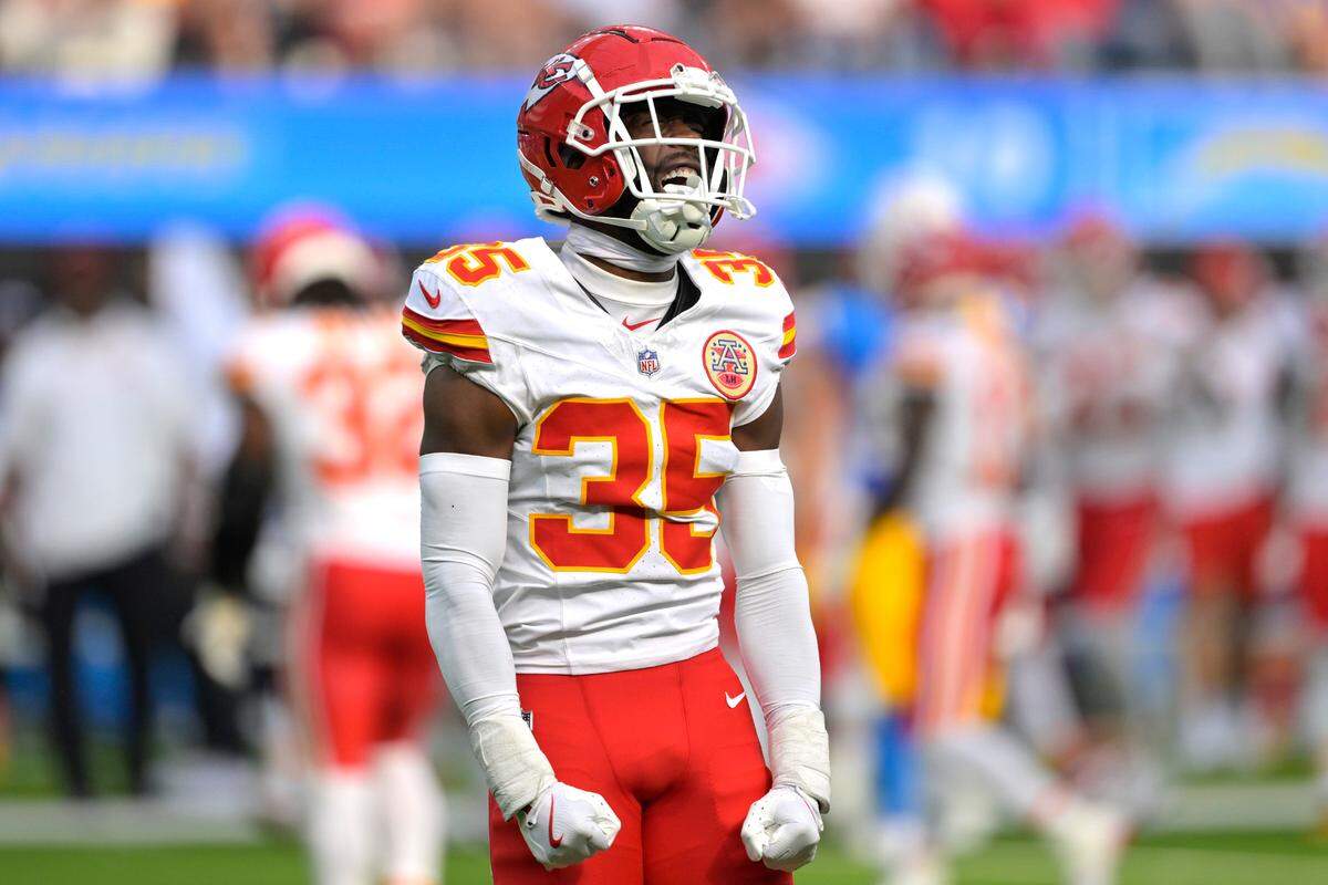Kansas City Chiefs cornerback Jaylen Watson (35) celebrates after breaking up a pass for Los Angeles Chargers wide receiver Joshua Palmer (5) in the second half at SoFi Stadium.