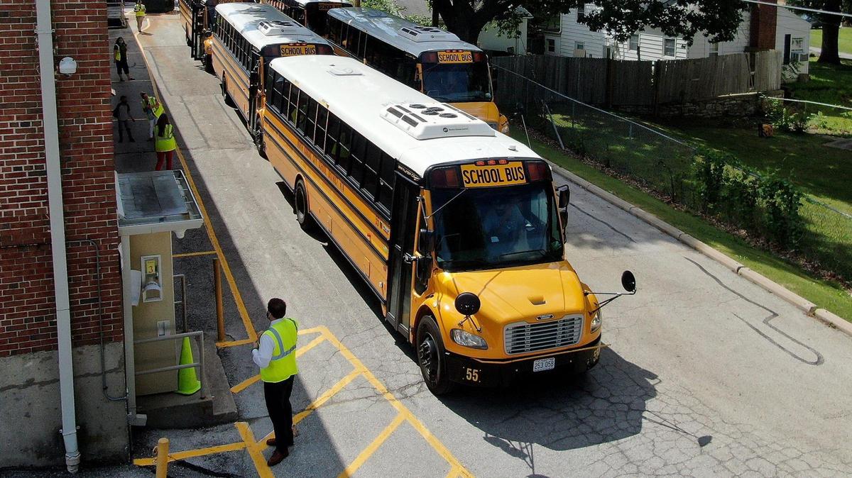 Students board buses at the end of the school day at Crestview Elementary in the Northland Thursday, July 16, 2020.