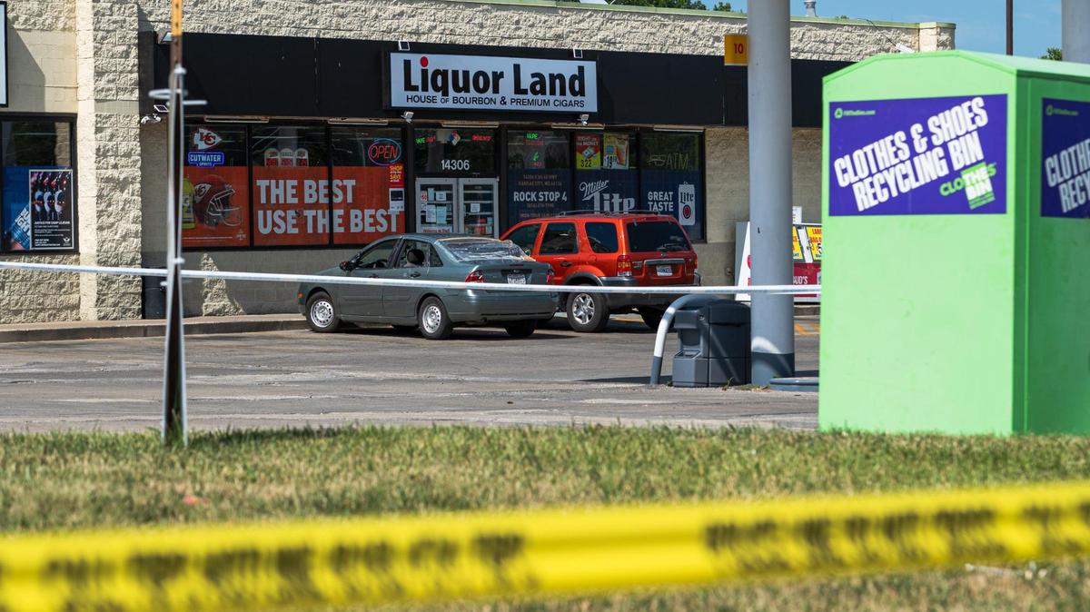 Police blocked off the parking lot of Liquor Land in Kansas City after Jon “Mike” Rone Jr. was fatally stabbed during an encounter with a man witnesses said was abusing people with racial slurs.