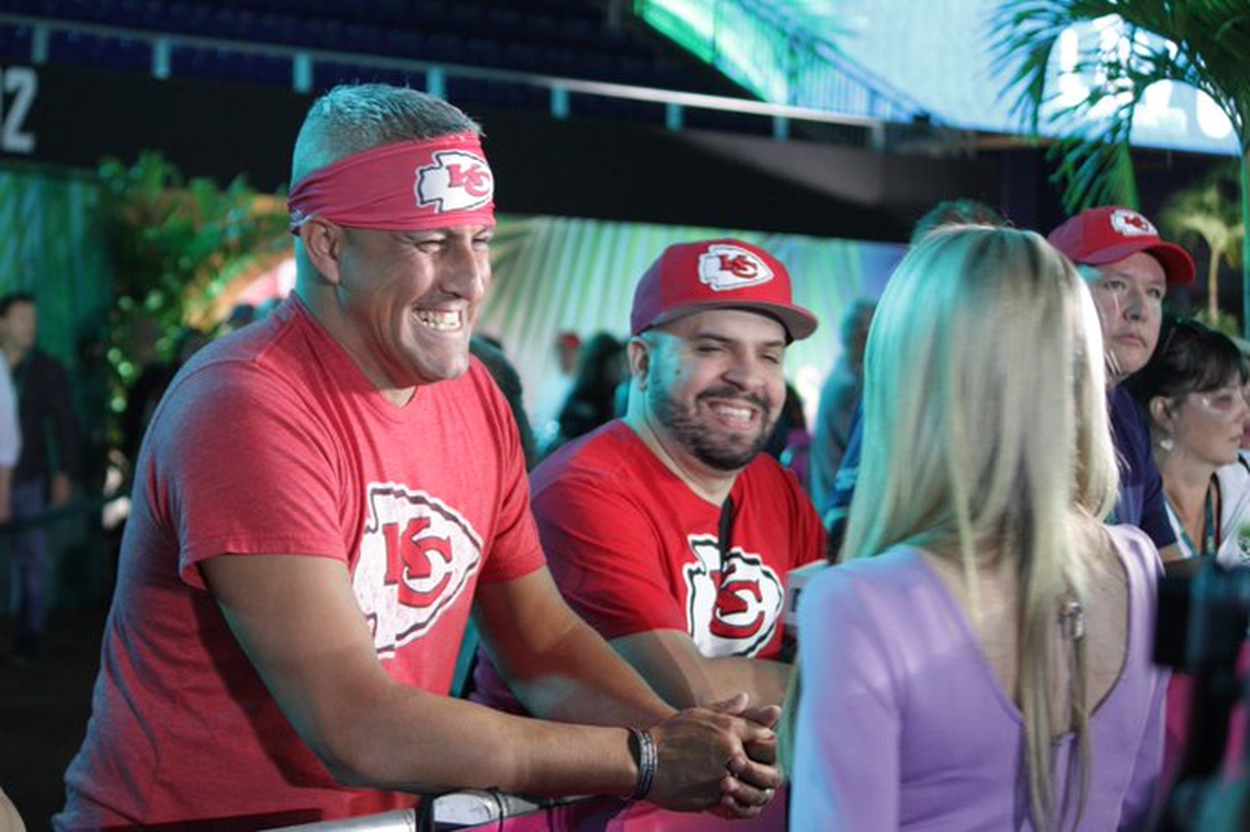 Chiefs fan and Miami native Christopher Perez, center, is interviewed at opening night for Super Bowl LIV.