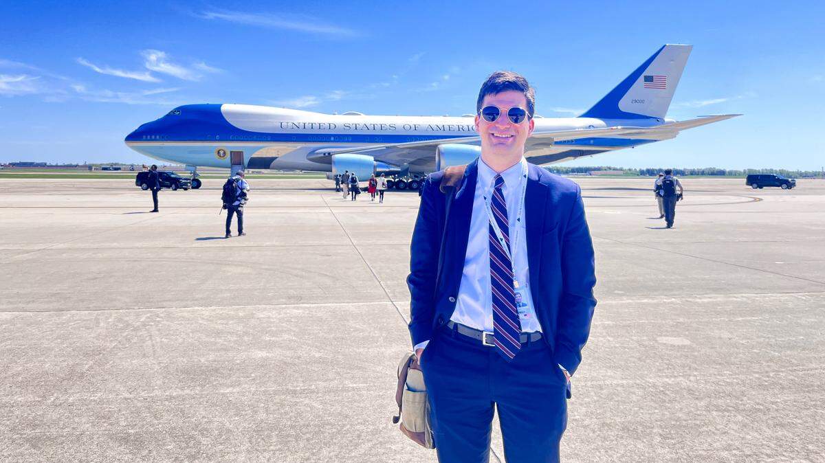 Kansas City Star reporter Daniel Desrochers poses in front of Air Force One on Tuesday, April 23, 2024.