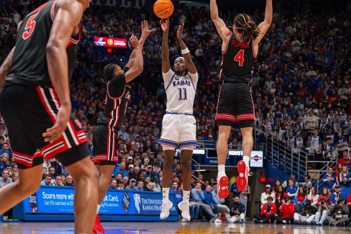 Kansas Jayhawks guard Jamari McDowell (11) shoots a 3-point shot in the second half vs. the Houston Cougars on Monday, February 23, 2026, at Allen Fieldhouse.