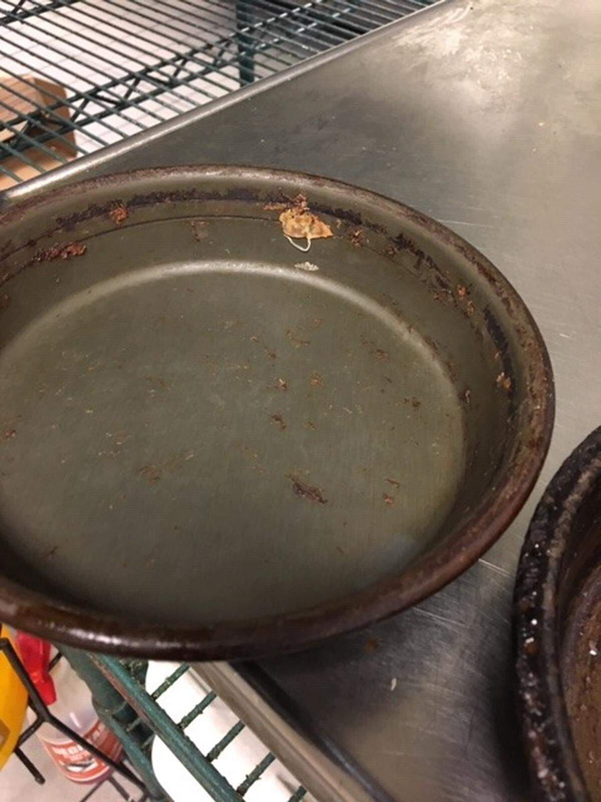 Pizza Hut was cited for pans that were put away as clean but that were still soiled.