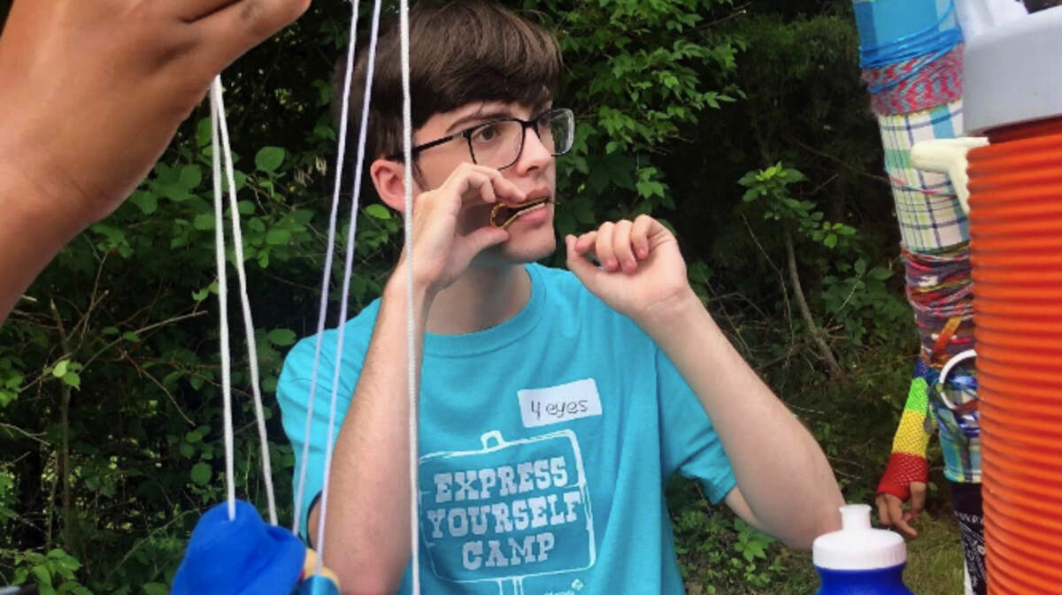 Devin Rice, a University of Kansas student from Kansas City, Kansas, attended the first Express Yourself Camp 10 years ago and is now a counselor there, working with children who have experienced some type of loss.