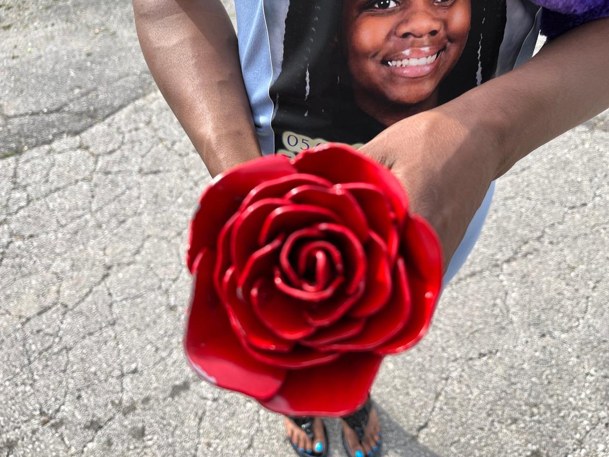 Kourtney Freeman’s mother, Samantha Freeman held up a rose that was given to her on April 15, 2024.