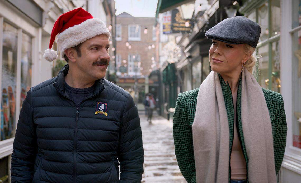 Ted (Jason Sudeikis) and his boss Rebecca (Hannah Waddingham) spread a little Christmas cheer in the “Carol of the Bells” episode of “Ted Lasso.”