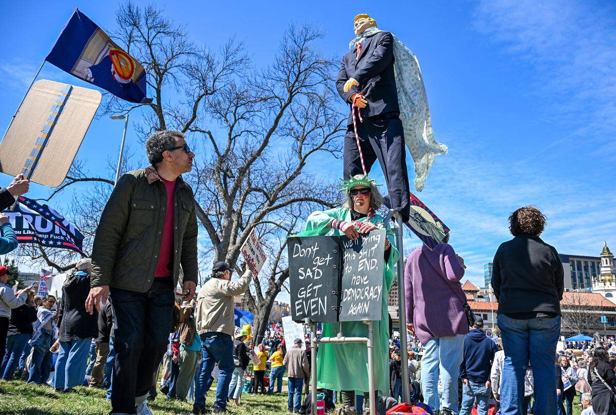 Protesters gathered in Mill Creek Park near the Country Club Plaza on Saturday, March 28, 2026, for a No Kings protest against the Trump administration. It's the third round of No Kings protests that have swept the nation over the past year.