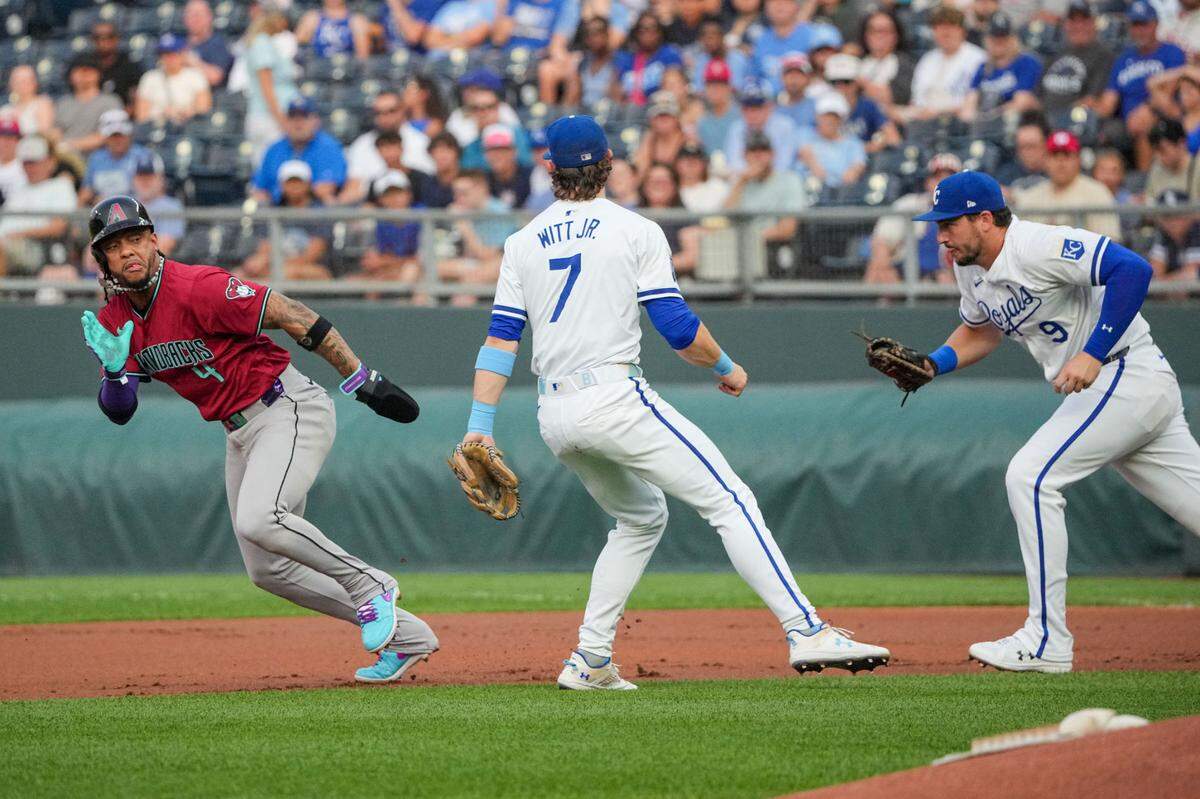 Kansas City Royals first baseman Vinnie Pasquantino, right, chases Arizona Diamondbacks second baseman Ketel Marte in a rundown during the first inning of Wednesday evening’s game at Kauffman Stadium.