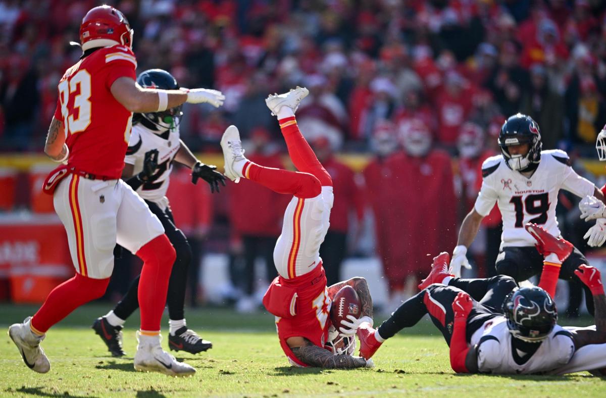 Kansas City Chiefs wide receiver Nikko Remigio (81) is upended after handling a kick return against the Houston Texans in the second quarter on Saturday, Dec. 21, 2024, at GEHA Field at Arrowhead Stadium.