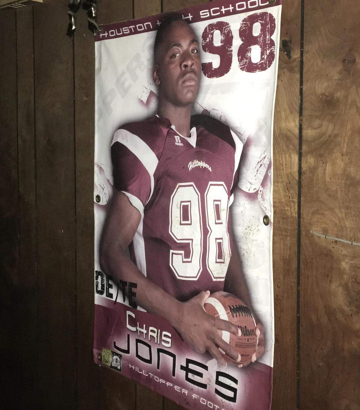 A poster from Chris Jones’ high school days in Houston, Mississippi, hangs in the hallway of his grandma’s house.