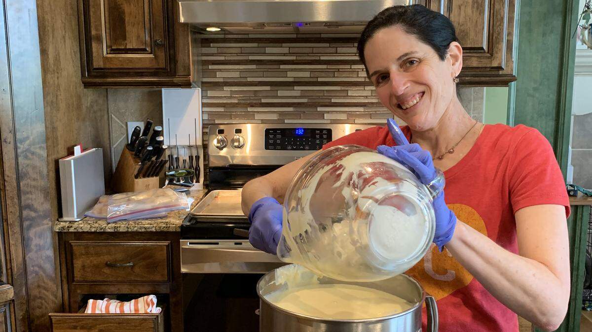 Caterer Kim Matsil works in her kitchen, preparing food that she would later deliver to people in the community who are elderly or otherwise homebound.