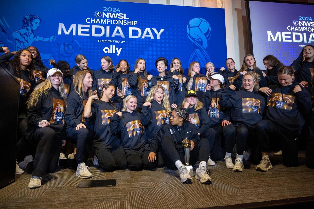 Washington Spirit team members pose for photos after midfielder Croix Bethune was named Midfielder of the Year during media day for the NWSL Championship at Union Station, Thursday, Nov. 21, 2024, in Kansas City.