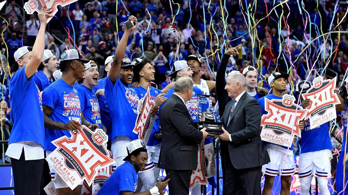 The Kansas Jayhawks celebrate after beating Texas Tech 74-65 to win the Big 12 Tournament championship Saturday at the T-Mobile Center in Kansas City.