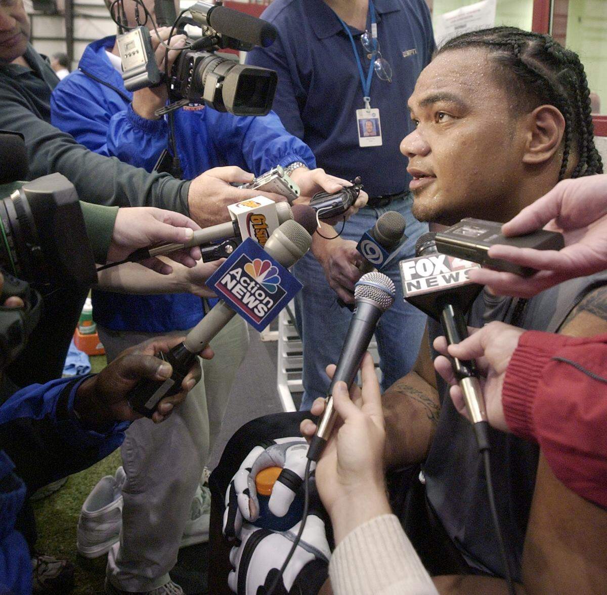 Newly signed with the Kansas City Chiefs, Junior takes questions from local reporters after practice at 2004’s rookie orientation weekend.