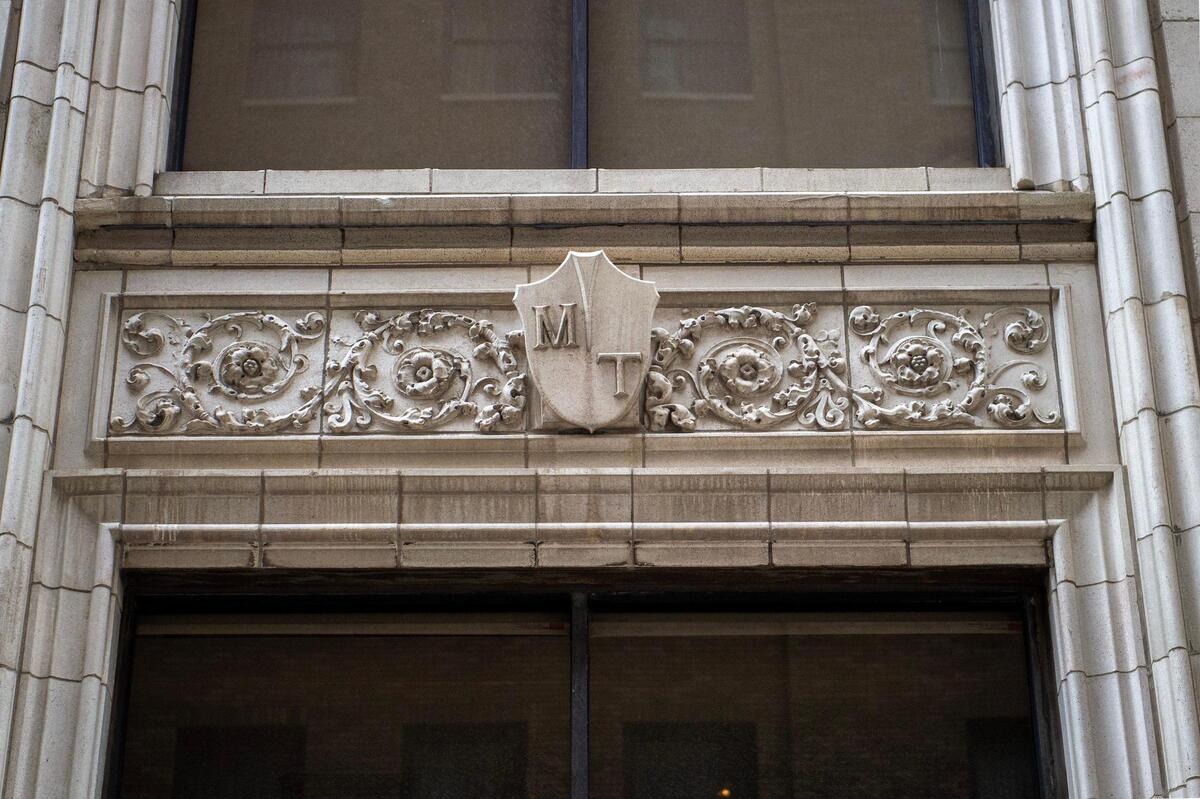 Early 1900s architectural craftsmanship on building facade at The Mark apartments at the corner of West 11th Street and Baltimore Avenue.