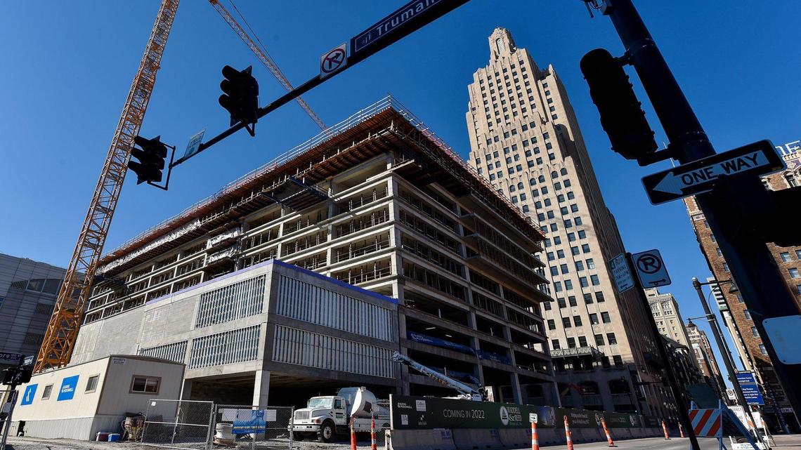 Waddell & Reed does not plan to move into a downtown Kansas City tower designed as its new corporate headquarters after it merges with Australia’s Macquarie Group. Construction continued Tuesday at the building at West 14th Street and Baltimore Avenue.
