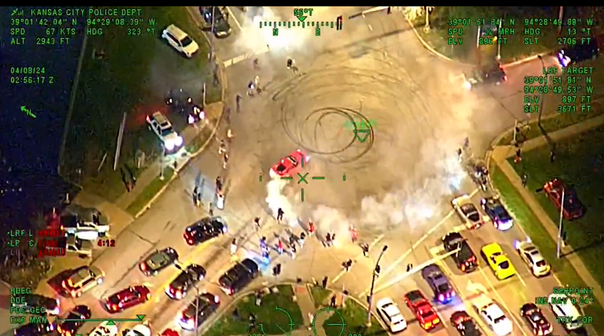 Helicopter surveillance footage from Kansas City police shows a car doing doughnuts in the intersection of Blue Ridge Boulevard and Sni-A-Bar Road. Illegal sideshows have been persisting in parts of Kansas City despite police and city efforts to deter them.