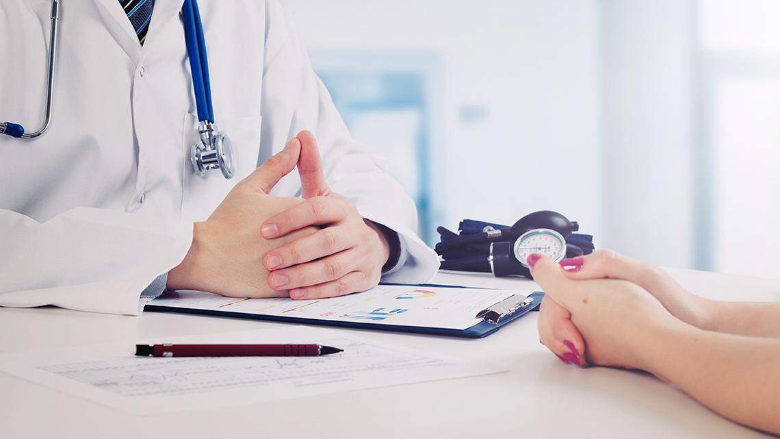 Doctor and patient medical consultation. doctor patient health care office desk stethoscope medicine healthcare