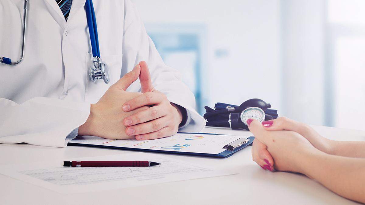 Doctor and patient medical consultation. doctor patient health care office desk stethoscope medicine healthcare