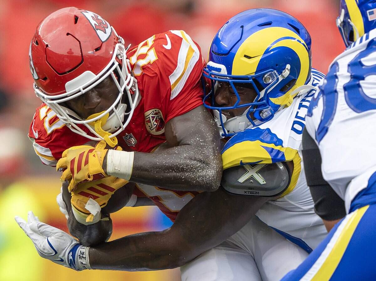 Kansas City Chiefs running back Emmett Johnson (10) is tackled in the third quarter during a preseason NFL game against the Los Angeles Rams at Arrowhead Stadium on Saturday, Aug. 15, 2026, in Kansas City.