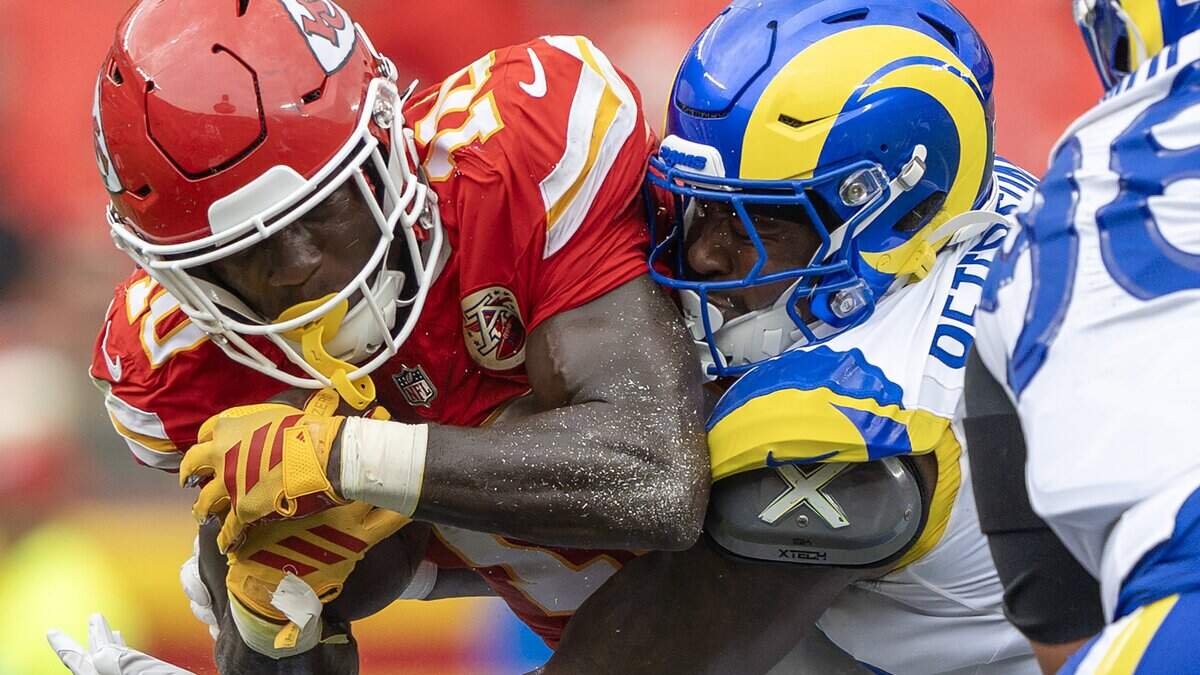 Kansas City Chiefs running back Emmett Johnson (10) is tackled in the third quarter during a preseason NFL game against the Los Angeles Rams at Arrowhead Stadium on Saturday, Aug. 15, 2026, in Kansas City.