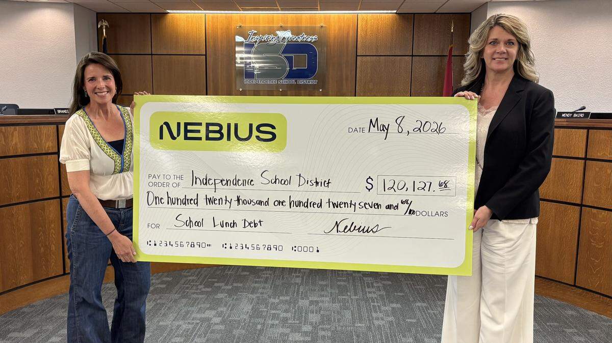 Former Independence spokesperson and current Nebius spokesperson Rebecca Gannon presents a check to Interim Independence School District Superintendent Dr. Cynthia Grant at a May 8, 2026 meeting. Just before breaking ground on a hyperscale AI data center in Independence, Nebius donated about $227,000 to ISD and the Fort Osage School District to eliminate about a years’ worth of student meal debt.