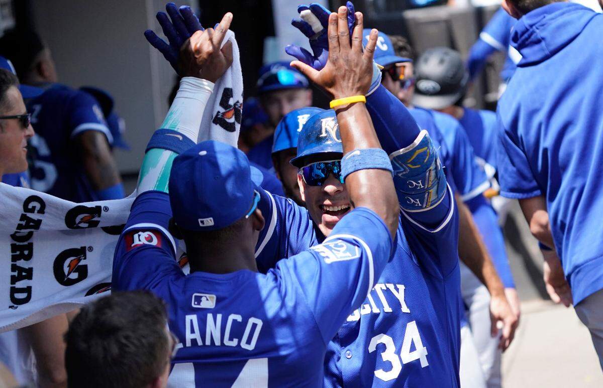 Kansas City Royals catcher Freddy Fermin (34) celebrates with outfielder Dairon Blanco (44) after hitting a two-run home run against the Chicago White Sox during the second inning at Guaranteed Rate Field.