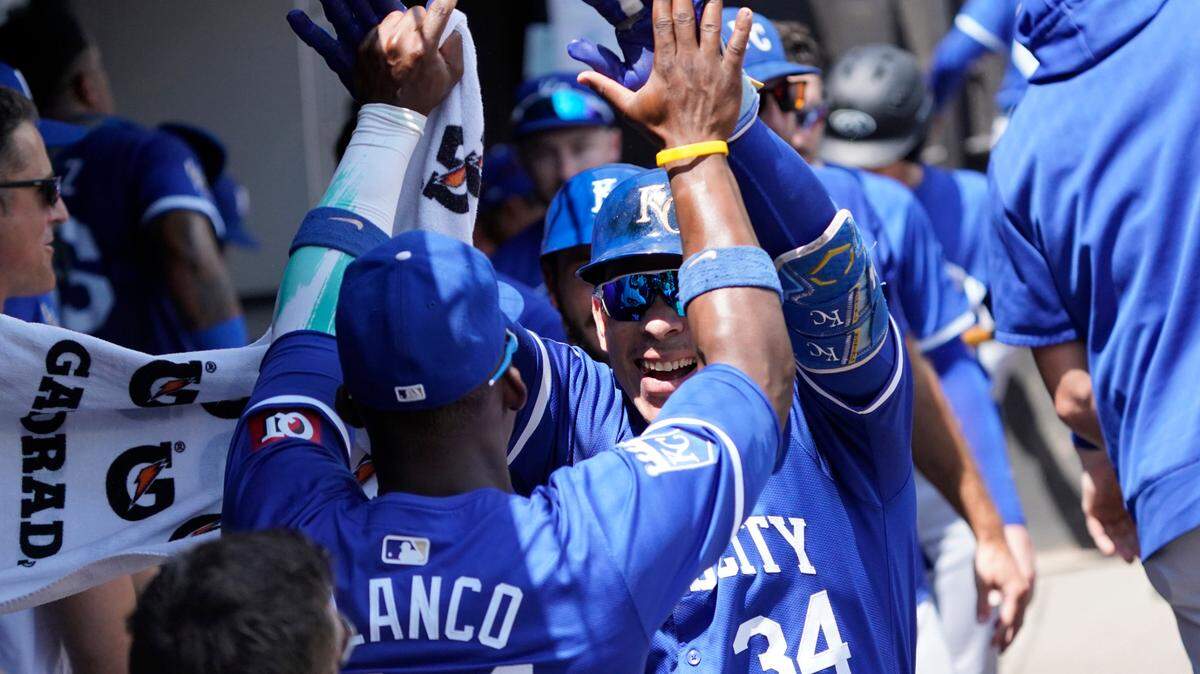 Kansas City Royals catcher Freddy Fermin (34) celebrates with outfielder Dairon Blanco (44) after hitting a two-run home run against the Chicago White Sox during the second inning at Guaranteed Rate Field.