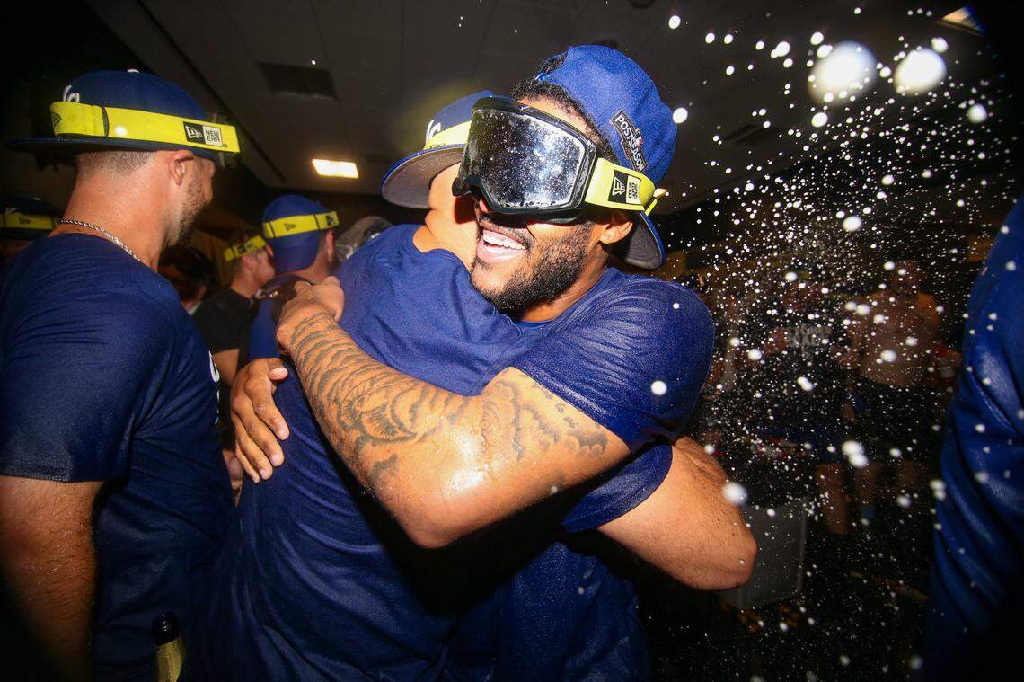 Kansas City Royals third baseman Maikel Garcia (11) celebrates after clinching a wild card playoff birth after a game against the Atlanta Braves at Truist Park.