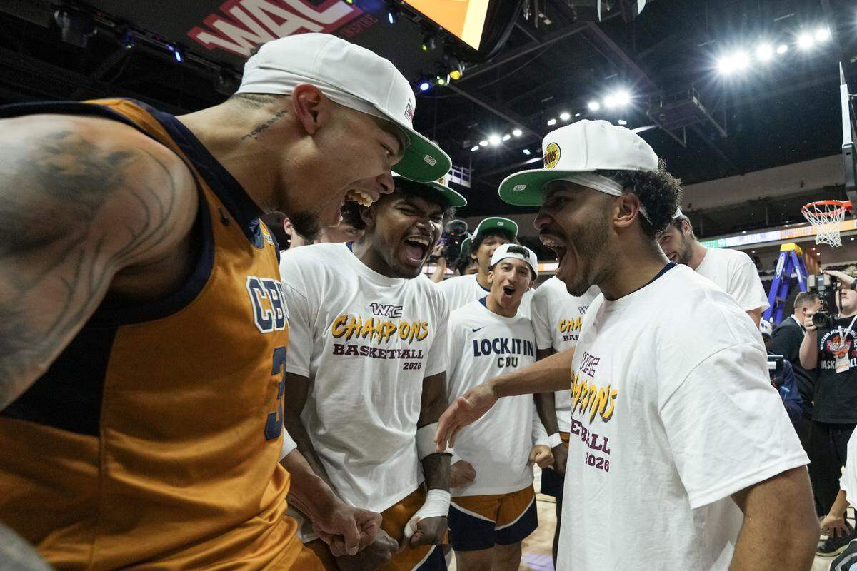 Jayden Jackson #3 and Dominique Daniels Jr. #1 of the California Baptist Lancers celebrate defeating the Wolverines 63-61 in the championship game of the Western Athletic Conference men’s basketball tournament at the Orleans Arena on March 14, 2026 in Las Vegas.