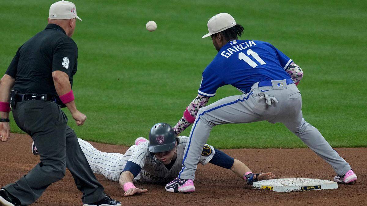 Milwaukee Brewers left fielder Christian Yelich beats the throw to Maikel Garcia ar second base during the third inning of Sunday’s game at American Family Field in Milwaukee, Wisconsin.