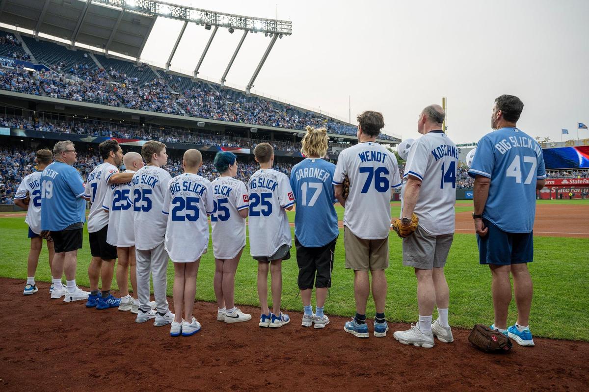 The hosts of the Big Slick lined up with guests for the start of the Royals game after the Celebrity Softball game on Friday, May 30, 2025, at Kauffman Stadium in Kansas City.