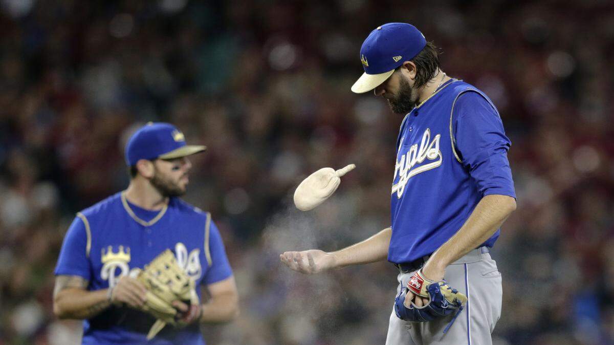 Royals starting pitcher Jason Hammel (right) gave up six earned runs on 13 hits to the Mariners in six innings of work on Saturday night in Seattle. The Royals lost 6-4.