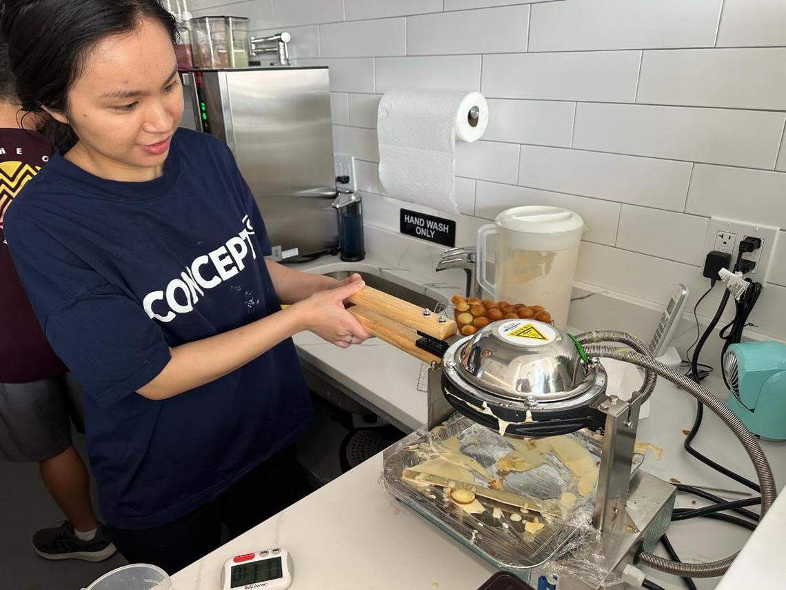 Zou’s sister-in-law, Ying Xie, makes a Hong Kong egg waffle.