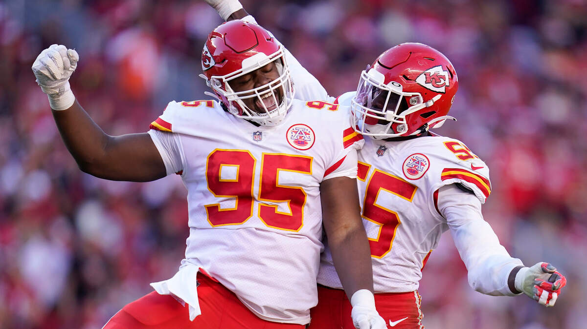 Kansas City Chiefs defensive tackle Chris Jones (95) celebrates defensive end Frank Clark during the second half of an NFL football game against the San Francisco 49ers in Santa Clara, Calif., Sunday, Oct. 23, 2022.