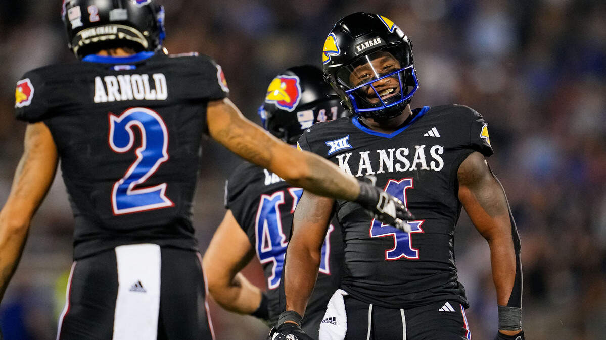 Kansas Jayhawks running back Devin Neal (4) reacts after a first down against the Illinois Fighting Illini during the second half at David Booth Kansas Memorial Stadium on Sept. 8, 2023.