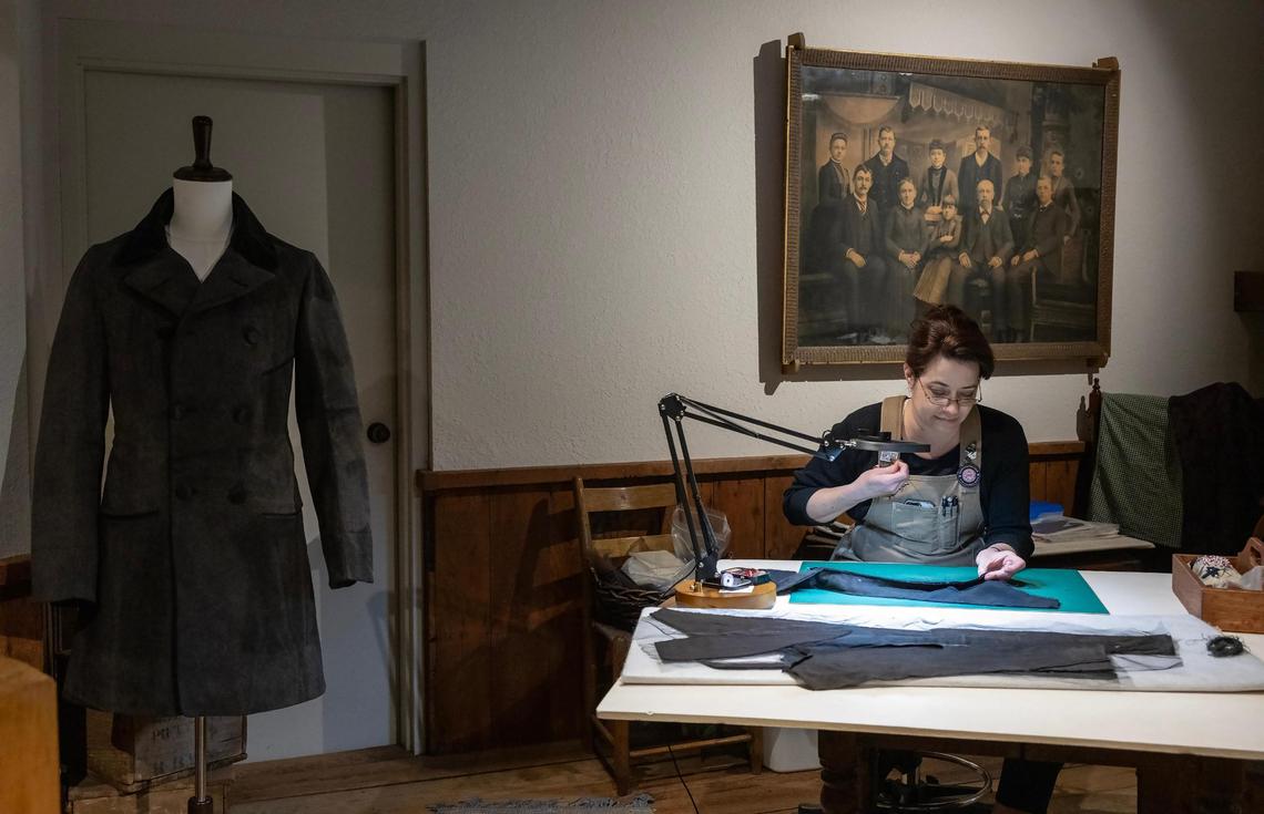 Textiles conservator Holly Messinger works on pieces of man’s frock coat she was preserving at the Arabia Steamboat Museum in Kansas City on Thursday, April 18, 2025. The coat, recovered from the Arabia steamboat which sank in 1856, has been stored in a freezer awaiting preservation since the recovery of the ship and its cargo in 1988.