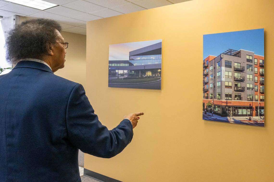Hagos Andebrhan, CEO and co-owner, of Taliaferro & Browne, points to a couple completed projects at their office in Kansas City, on Wednesday, February 11, 2026. Some of the engineering firm's landmark projects include the Power & Light District, Kauffman Performing Arts Center, and the ongoing 18th and Vine District initiative.