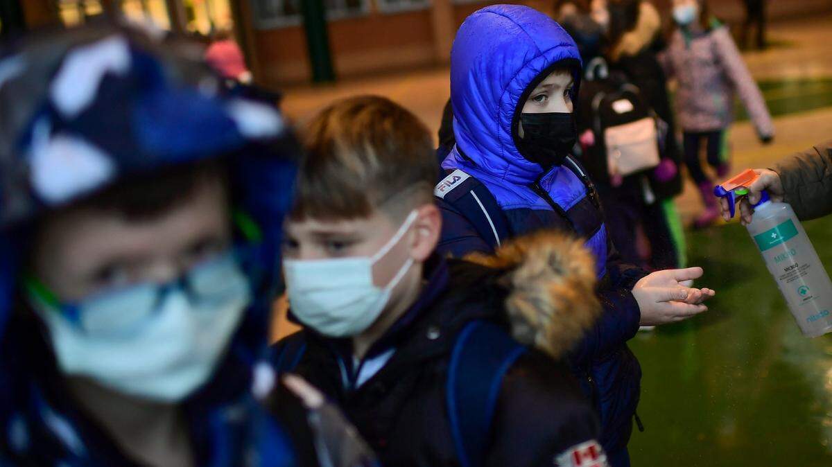 Though some school districts have dropped their mask mandates, many students are still required to wear masks.