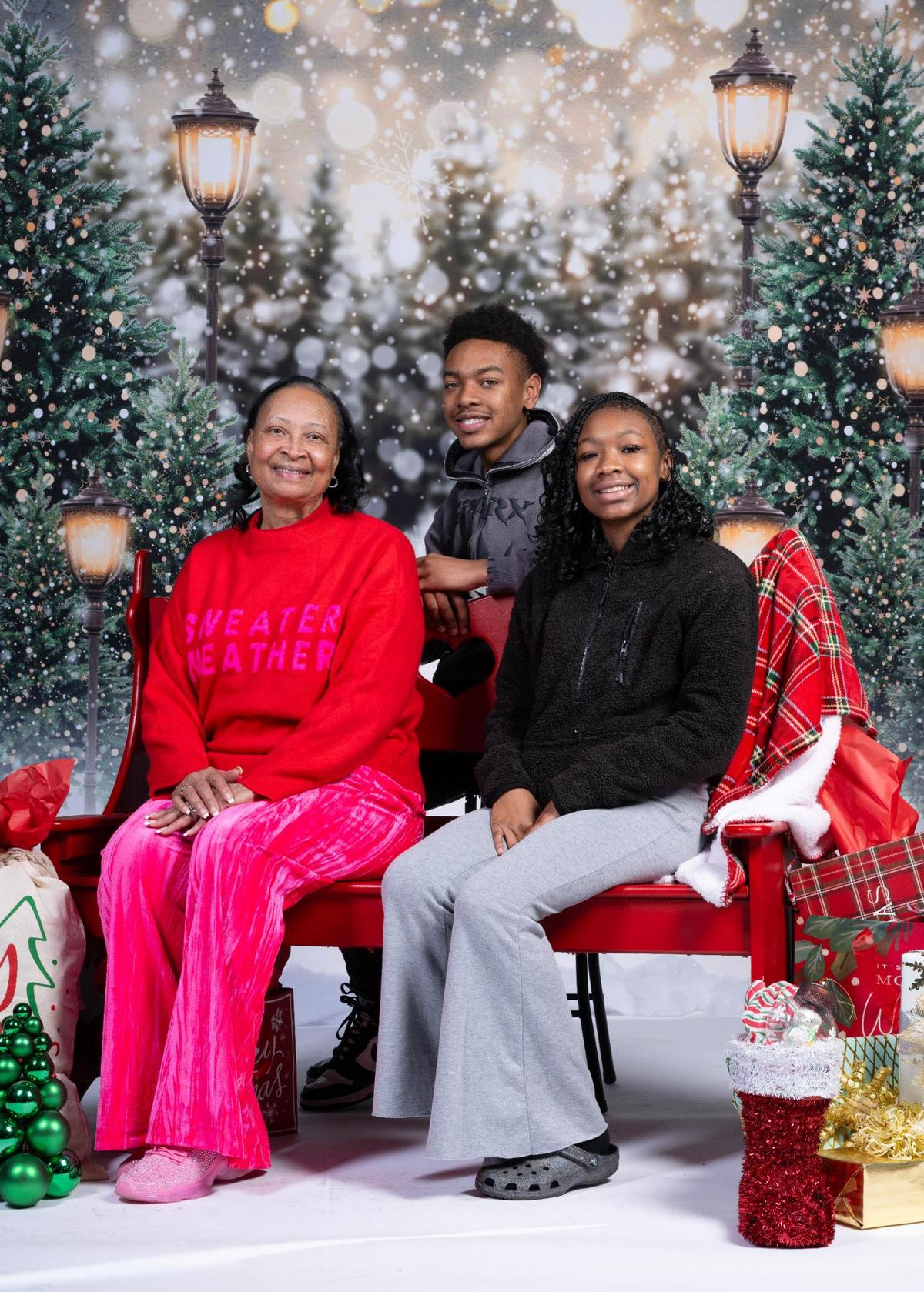 Branda Williams, Caleb Strother and Chira Strother at the Soul of Santa breakfast.