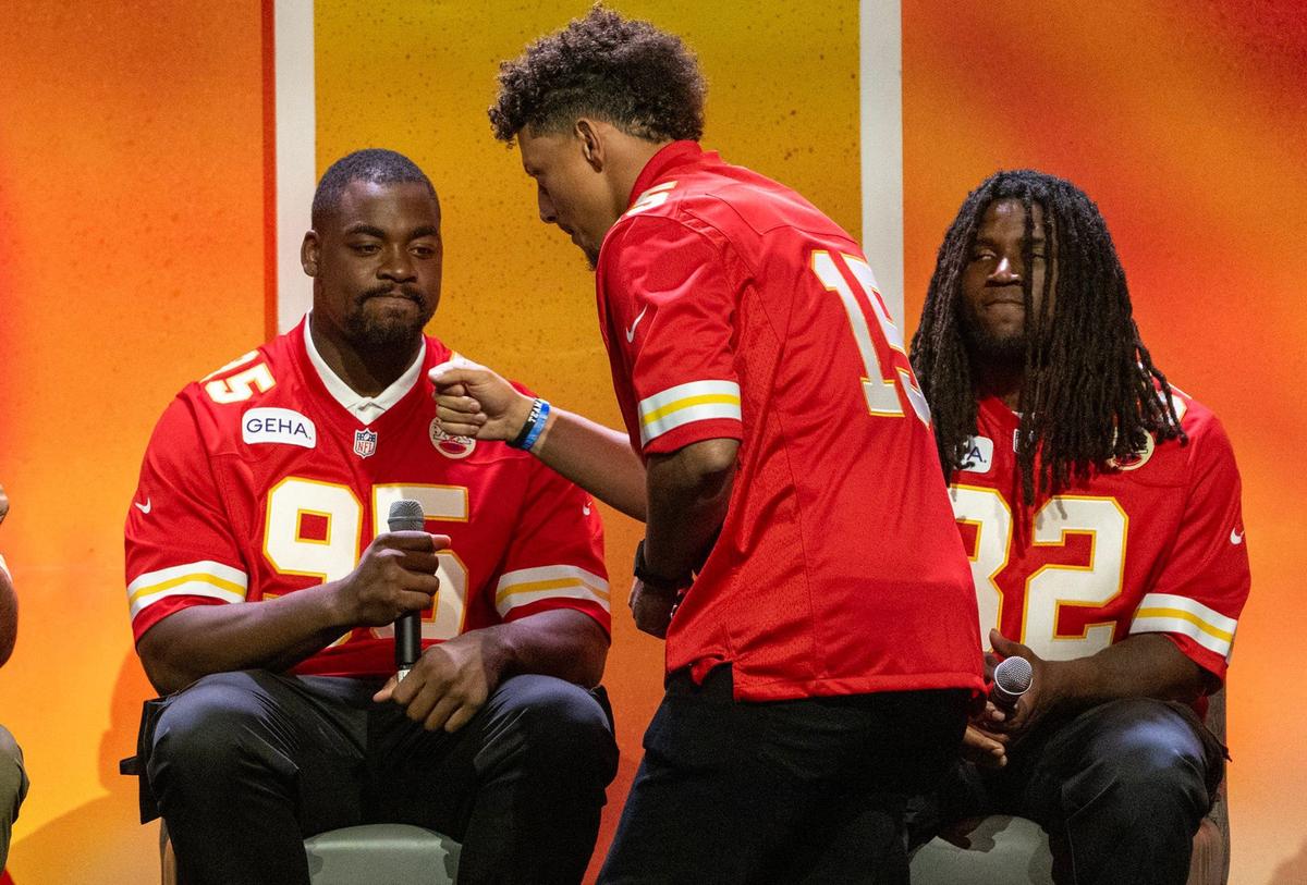 Kansas City Chiefs quarterback Patrick Mahomes (15), greets defensive tackle Chris Jones (95), as linebacker Nick Bolton (32), looks on during the 2024 Chiefs Kickoff Luncheon on Wednesday, August 28, at the Loews Kansas City Hotel.