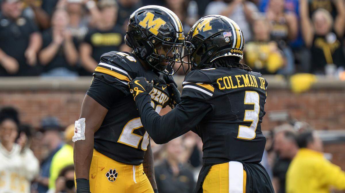 Missouri Tigers running back Jamal Roberts (20) and wide receiver Kevin Coleman Jr. (3) celebrate a touchdown in the fourth quarter during a game against the Kansas Jayhawks at Faurot Field at Memorial Stadium on Saturday, Sept. 6, 2025, in Columbia.