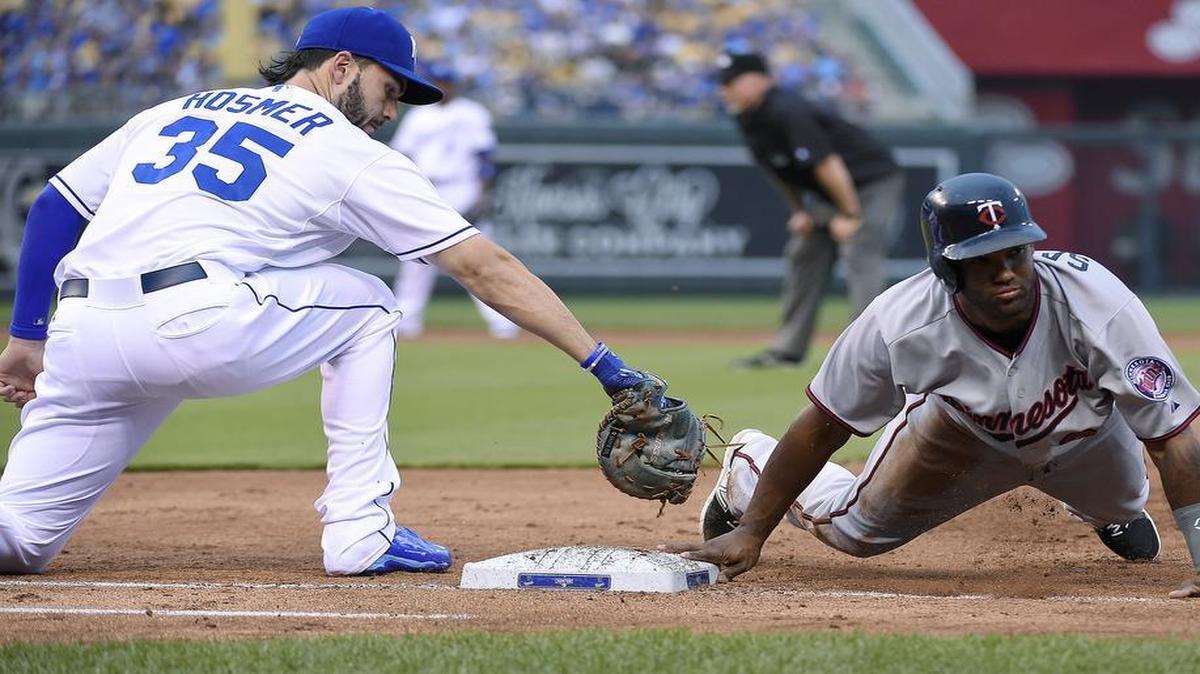 
Minnesota Twins' Danny Santana (39) dived back to first before the throw to Kansas City Royals first baseman Eric Hosmer (35) in the third inning on July 2, 2015, at Kauffman Stadium.
