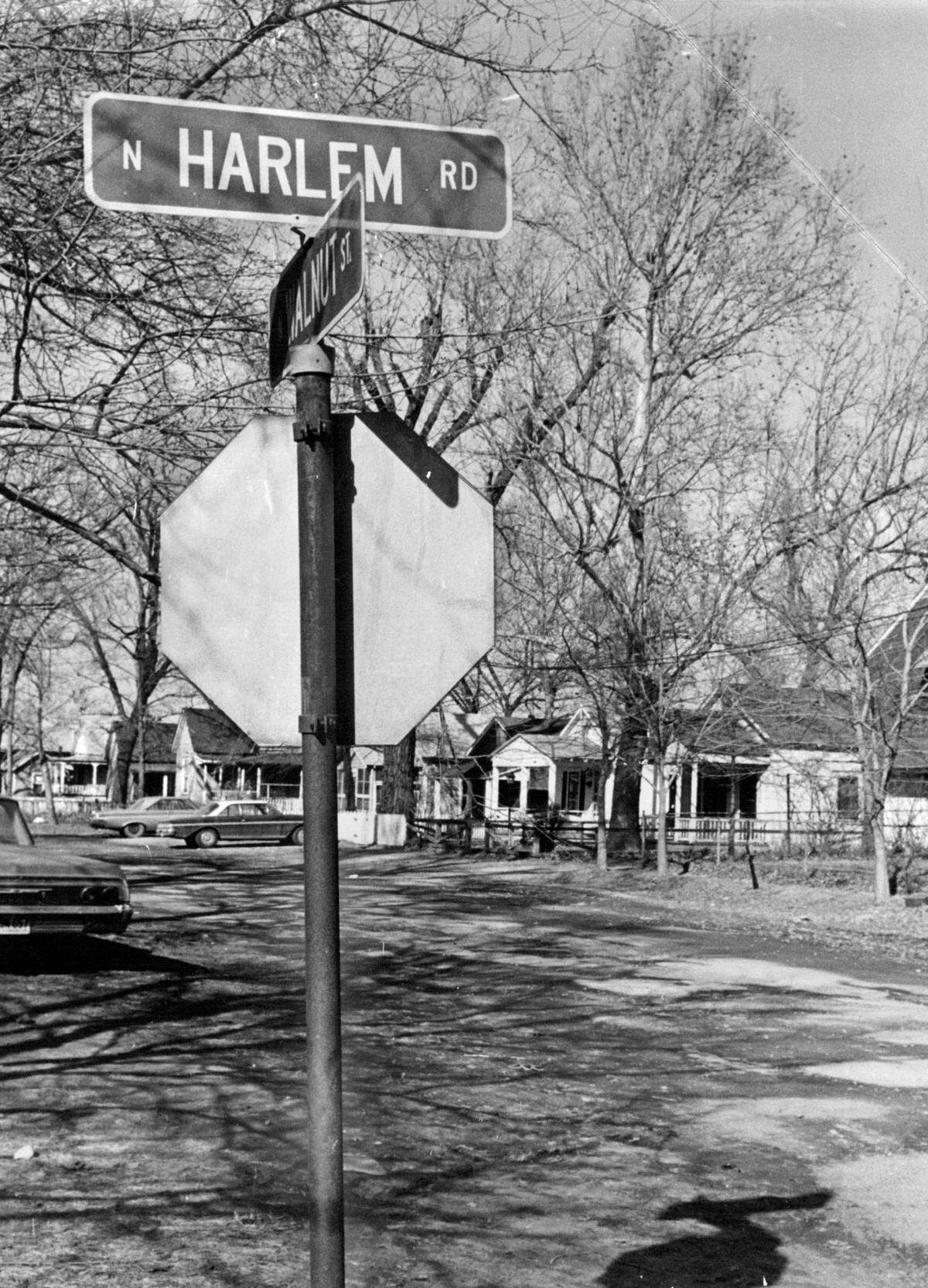 Generations of laborers and fishermen called Harlem, Missouri, home, their cottages enduring two major Missouri River floods. This 1970s photo captures the quiet afternoon light on this resilient riverfront community, even as freight terminals and industry began to push in, promising a changing landscape.