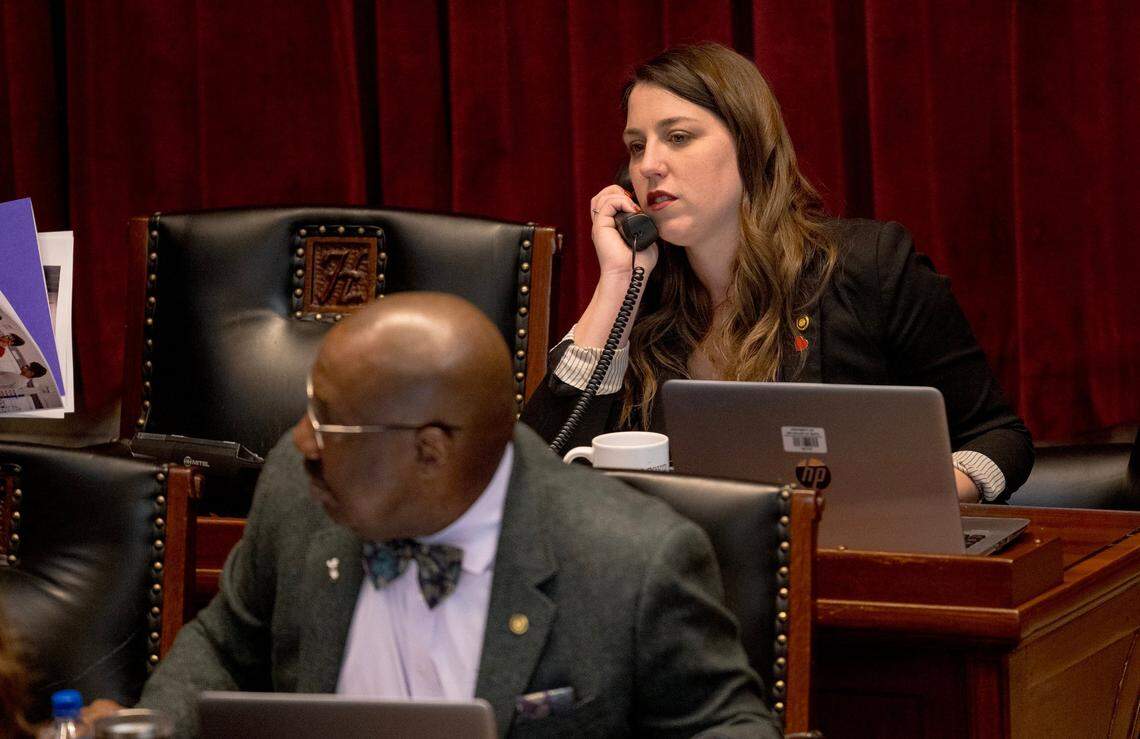 Missouri House Minority Leader Crystal Quade, a Springfield Democrat running for governor, speaks on the phone during a discussion of a bill on Wednesday, Feb. 21, 2024, in Jefferson City.