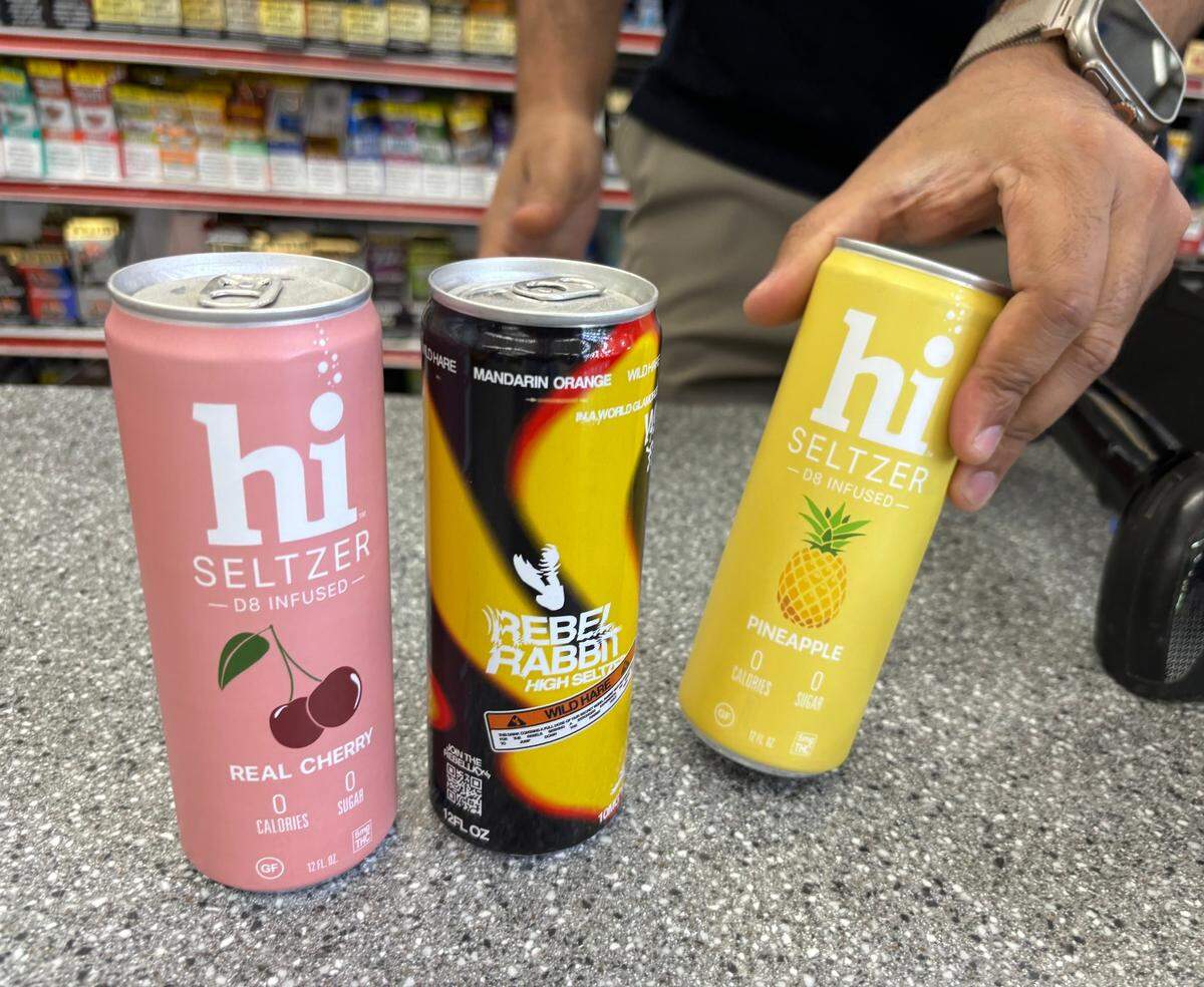 Royal Liquor Manager JD Ali shows Delta-8 and Delta-9 infused seltzer drinks. The Kansas City business will not be able to sell any “psychoactive cannabis products” after an executive order by Governor Mike Parson. August 5, 2024.