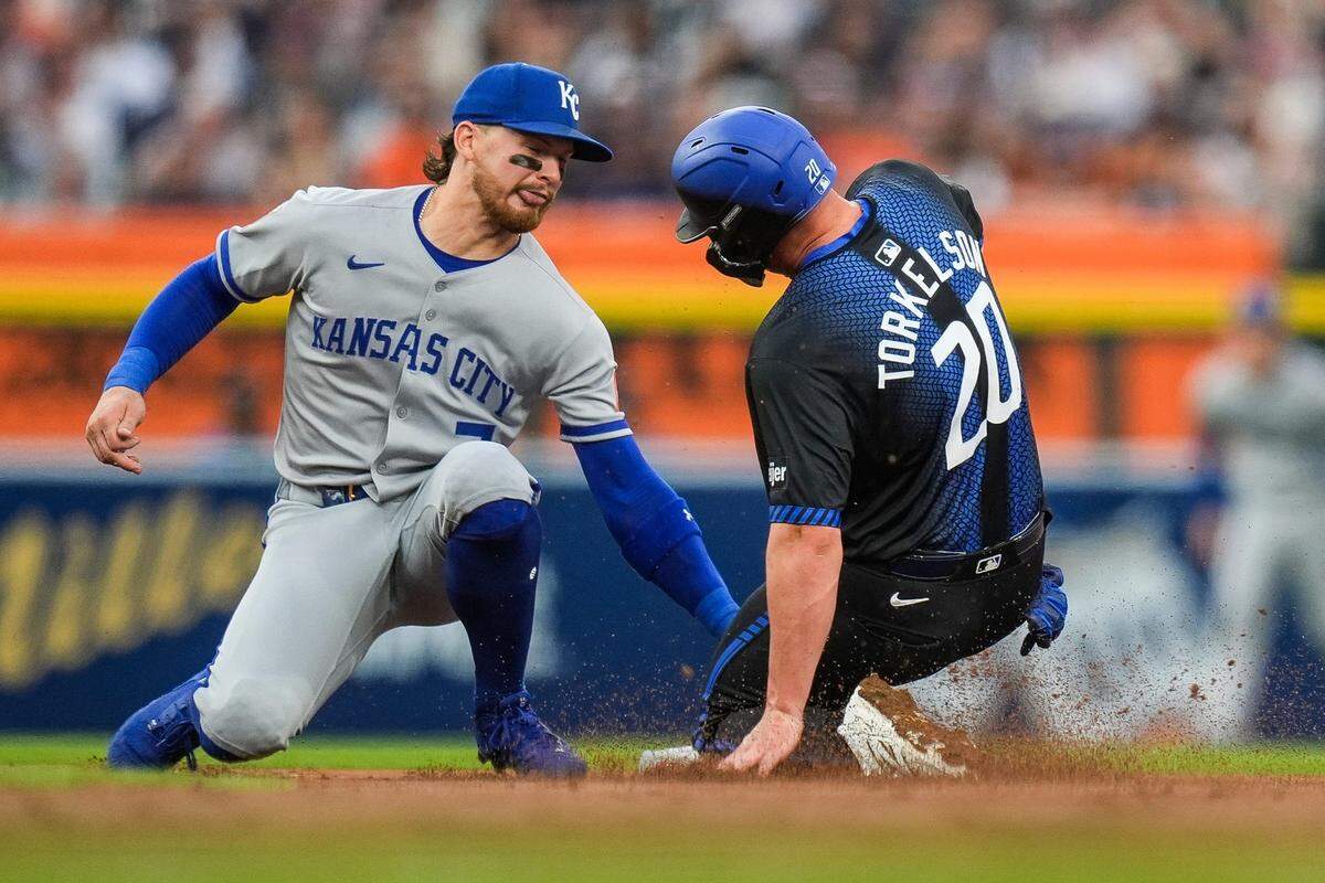 Detroit Tigers first base Spencer Torkelson (20) slides into second base Kansas City Royals shortstop Bobby Witt Jr. against during the second inning at Comerica Park in Detroit on Friday, April 18, 2025.