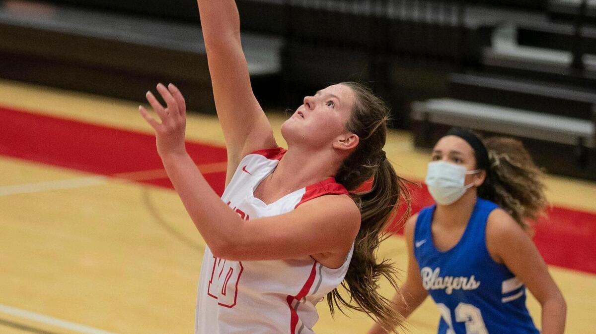 Kamryn Farris #10 of Lansing went for 2 during the game against Gardner Edgerton at Lansing Friday, Jan. 22, 2021